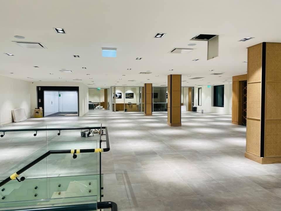 Large open-plan commercial office space with professional white ceiling and wall painting in Sydney